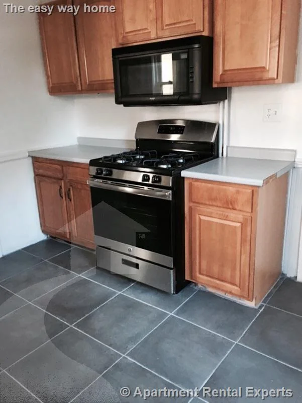 2 bed, 1 bath apartment for rent at 12 Charles E Ryan Rd Unit 1, Magoun Square — photo 2 of 17