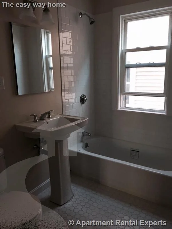 2 bed, 1 bath apartment for rent at 12 Charles E Ryan Rd Unit 1, Magoun Square — photo 7 of 17