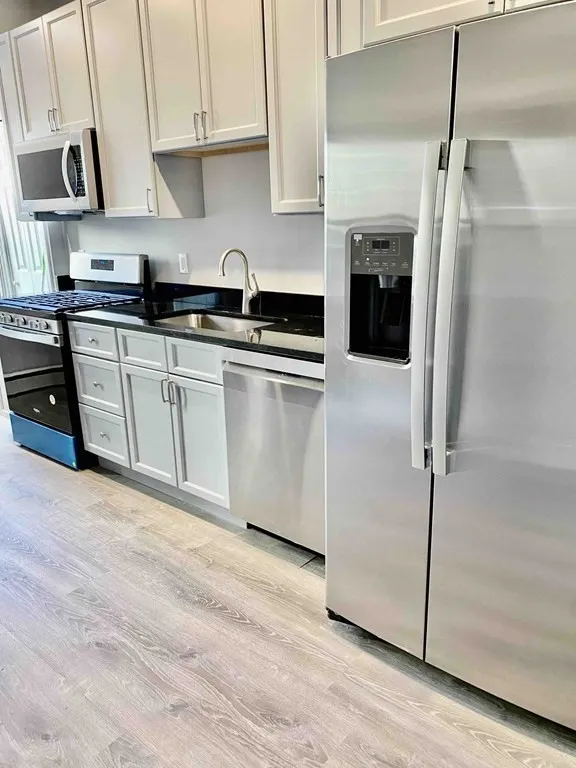 5 bed, 2 bath apartment for rent at 12 O St Unit 1, South Boston — photo 2 of 17